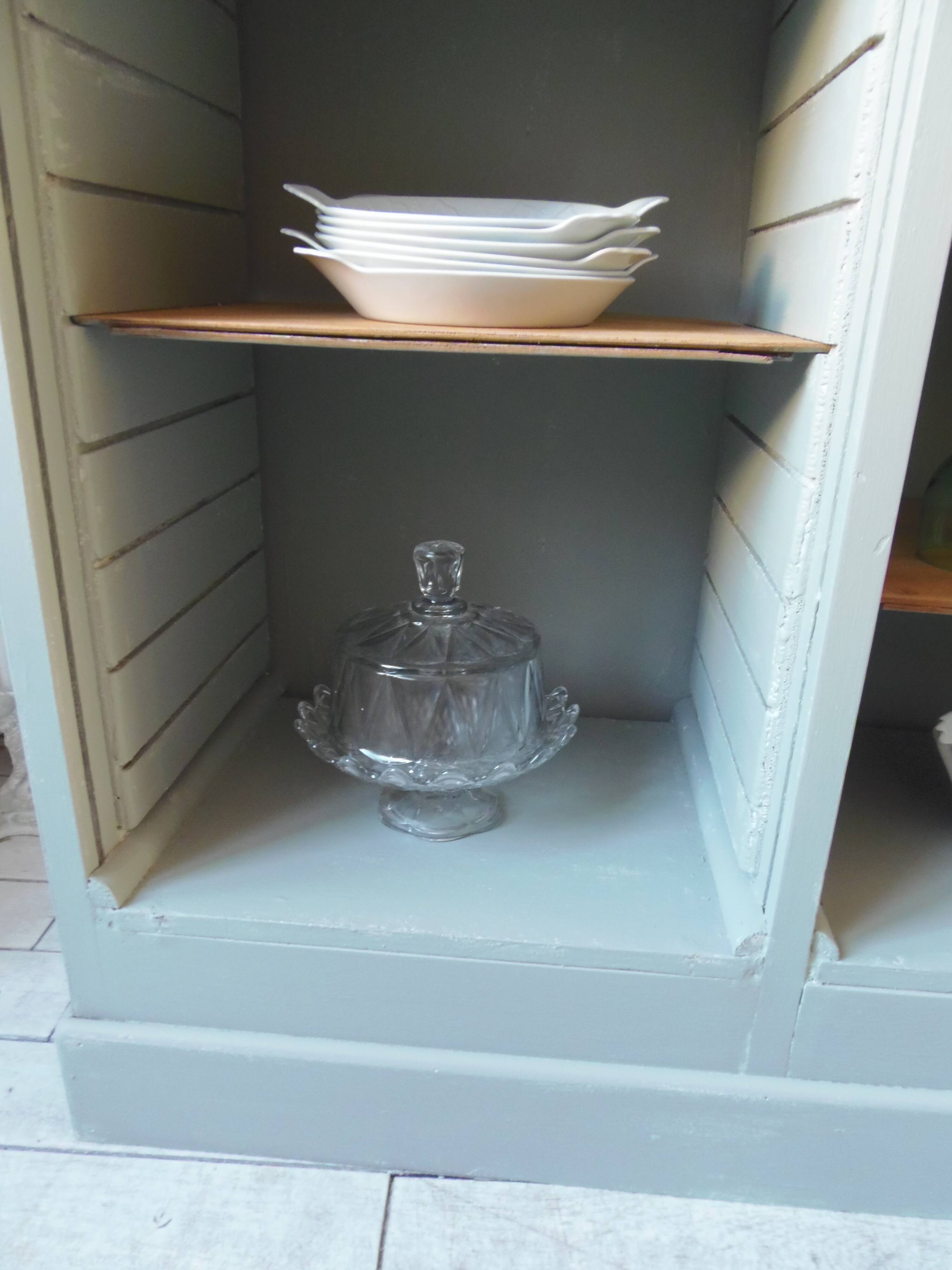 Vintage furniture transformed into a bookcase, verdigris patinated sideboard.