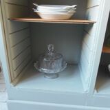 Vintage furniture transformed into a bookcase, verdigris patinated sideboard.