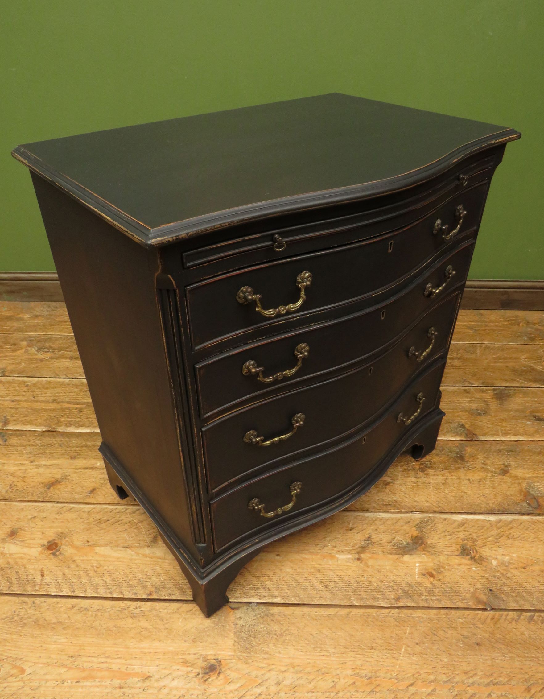 Antique black painted serpentine bachelors chest of drawers