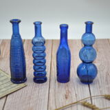 Set of 4 blue bottles of decoration