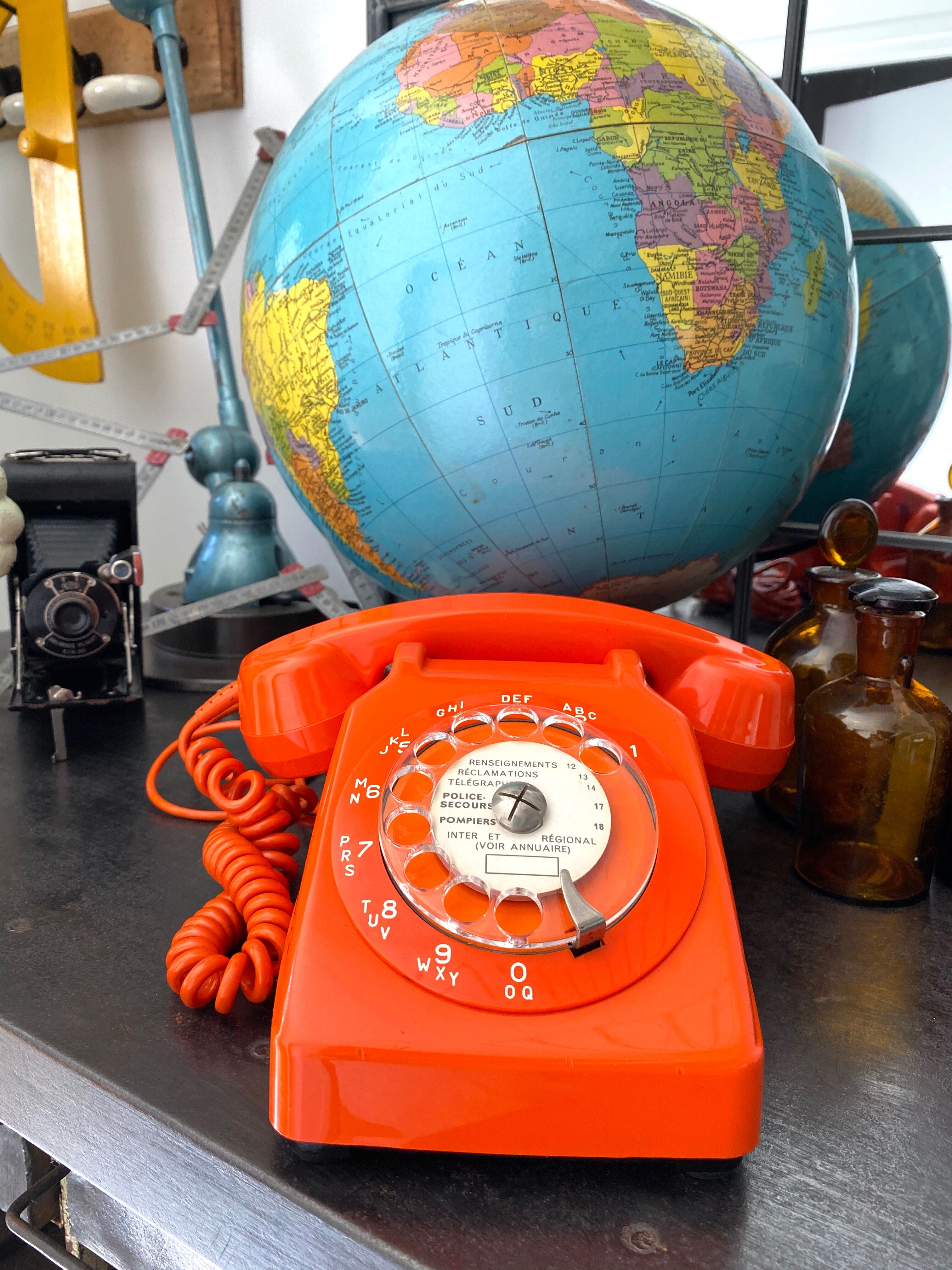 Orange vintage dial phone