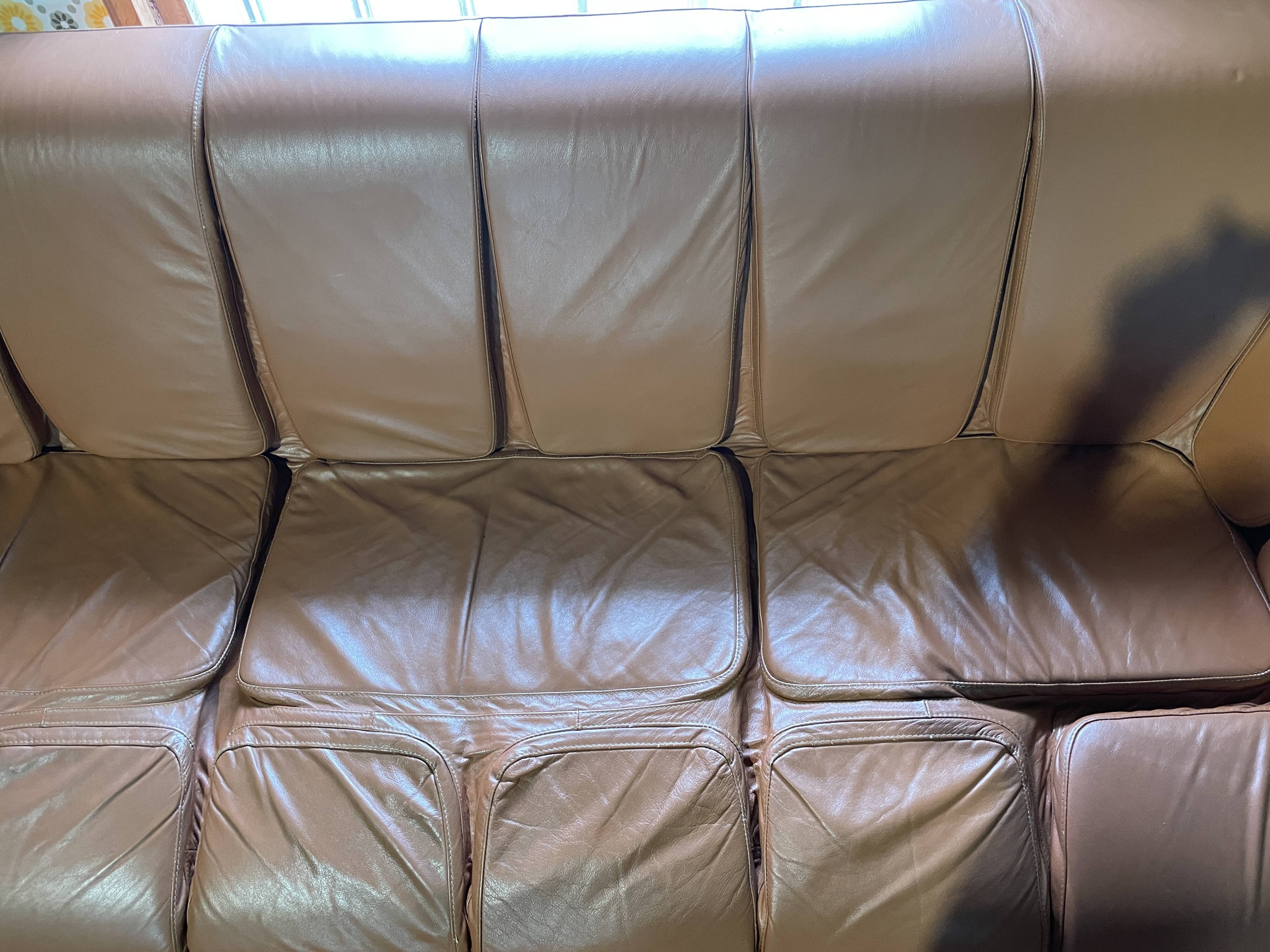 Percival lafer mp-211 sofa set with two armchairs and an ottoman in leather.