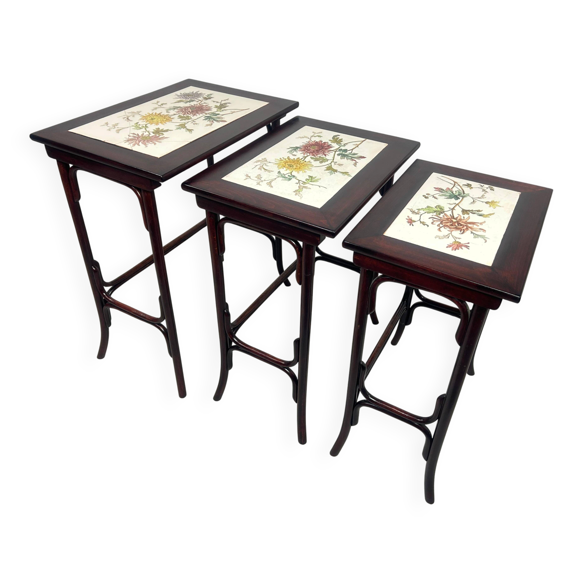 Nested tables in curved wood with ceramic top by Thonet.