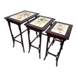 Nested tables in curved wood with ceramic top by Thonet.