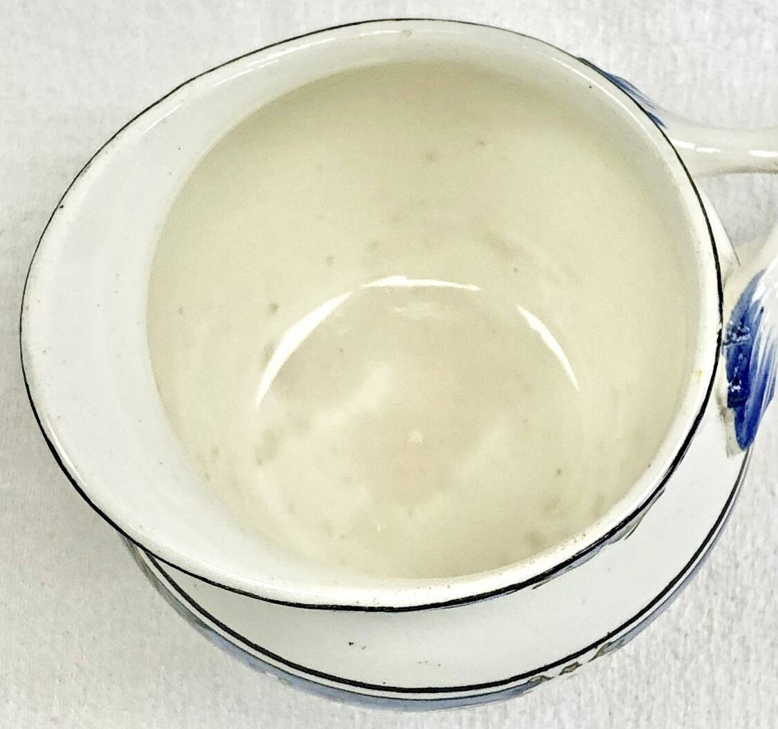 Old cream jug for children at the Dionysos press Gien