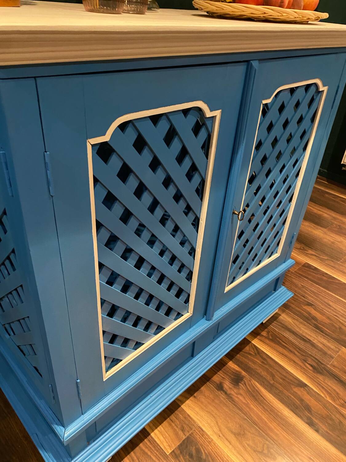 Large colonial style wooden cabinet with latticework