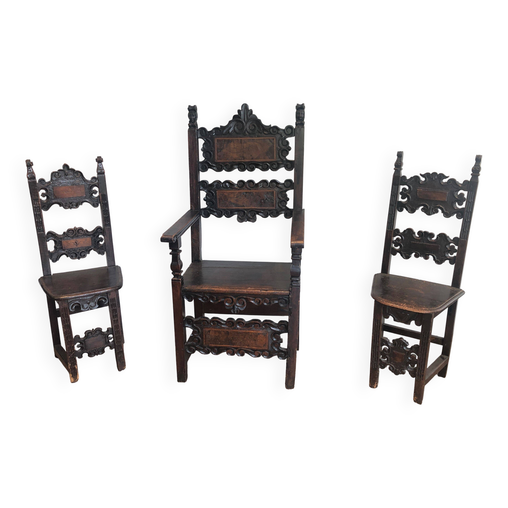 Set of an armchair and a pair of chairs in Italian Renaissance walnut