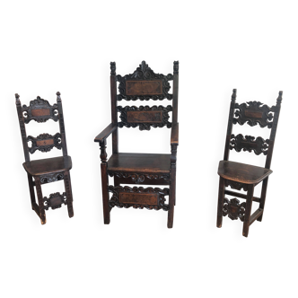 Set of an armchair and a pair of chairs in Italian Renaissance walnut