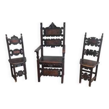 Set of an armchair and a pair of chairs in Italian Renaissance walnut