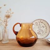 Antique amber glass pitcher