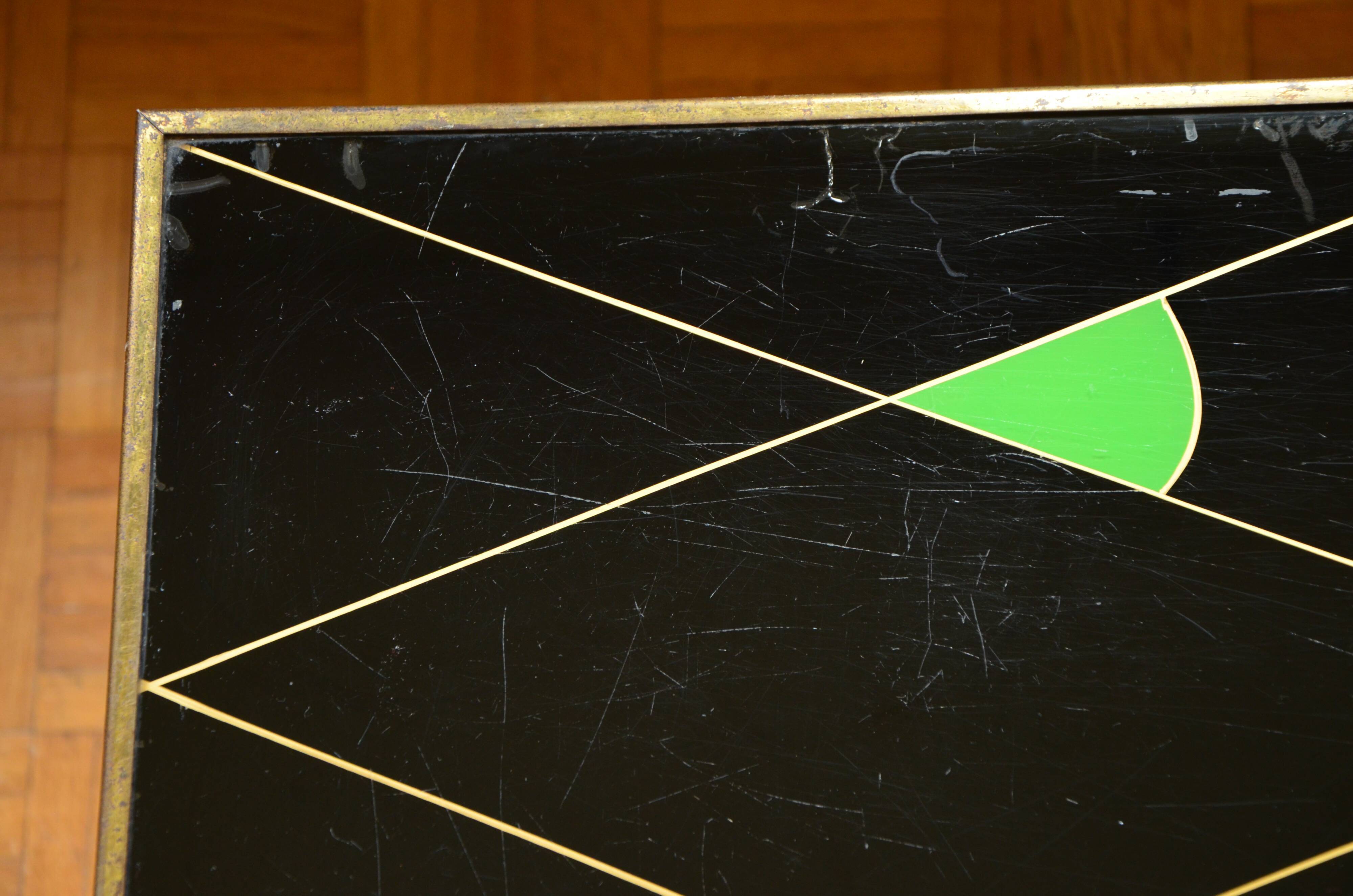 Brass and glass coffee table with compass feet