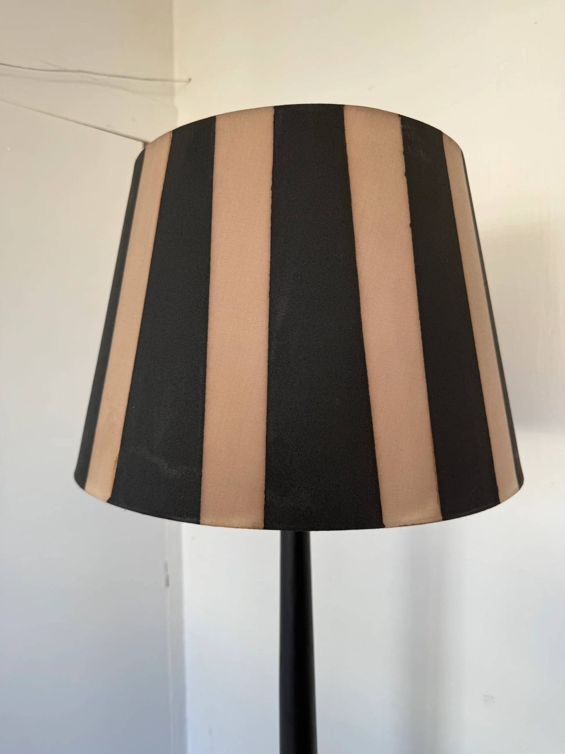 Vintage floor lamp in black patinated wood and striped lampshade