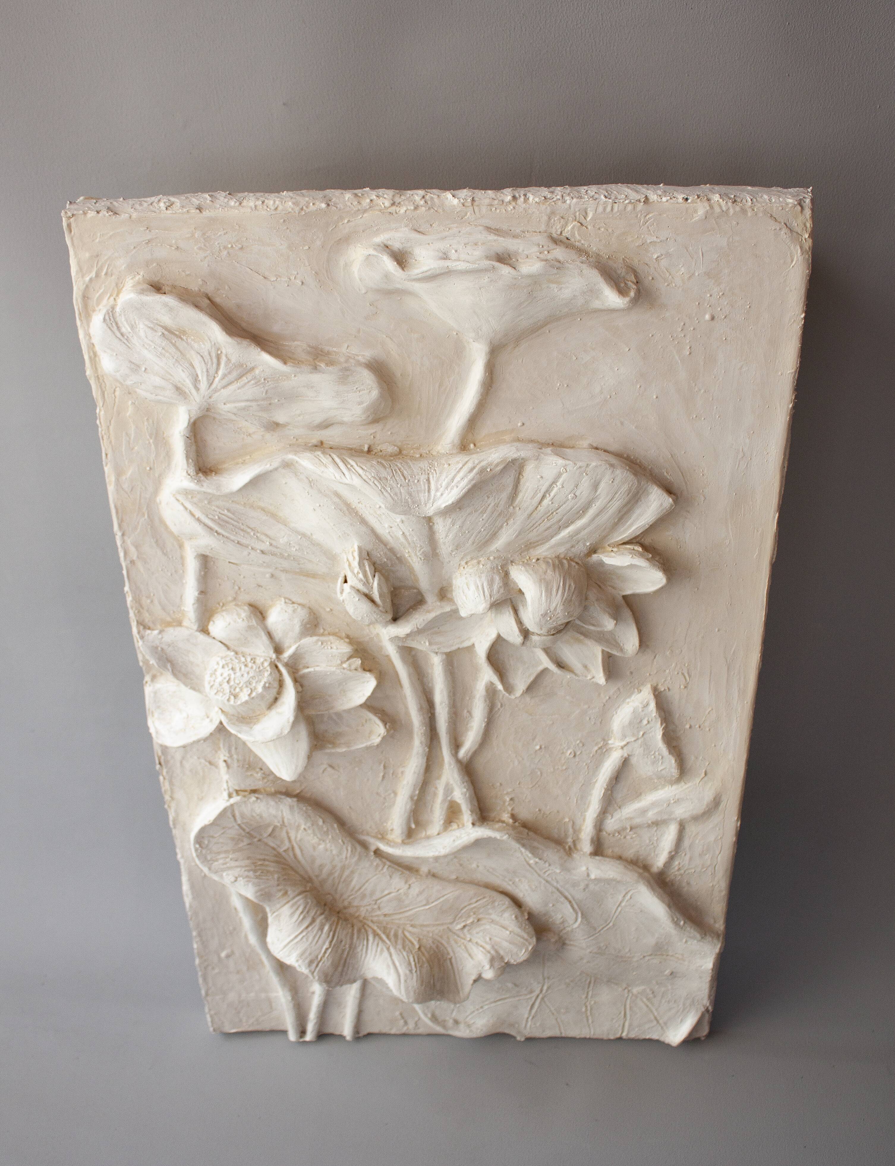 Bas-relief with flowers. Relief with flowers. Flowers in relief.
