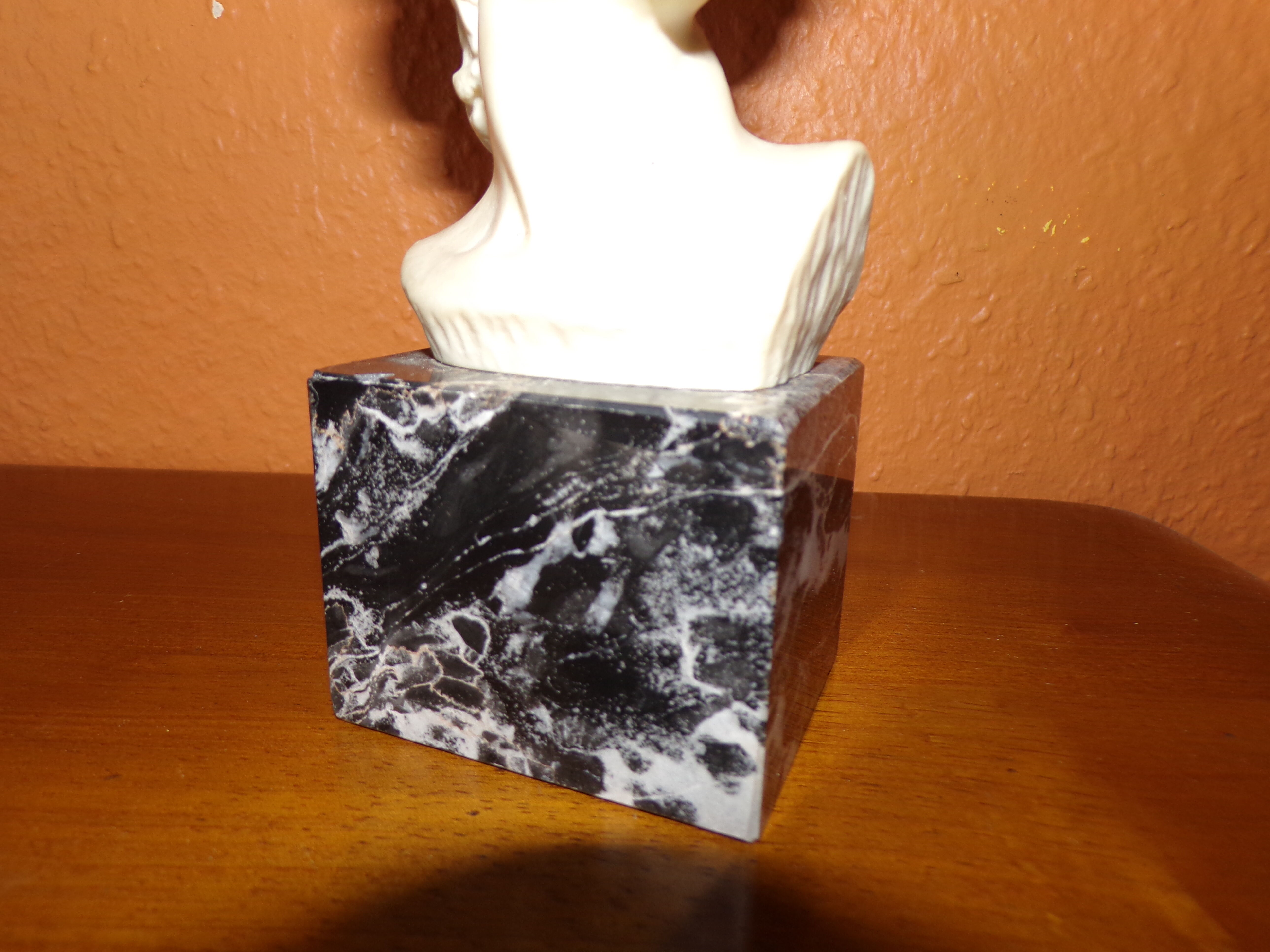 Ancient subject bust on marble base