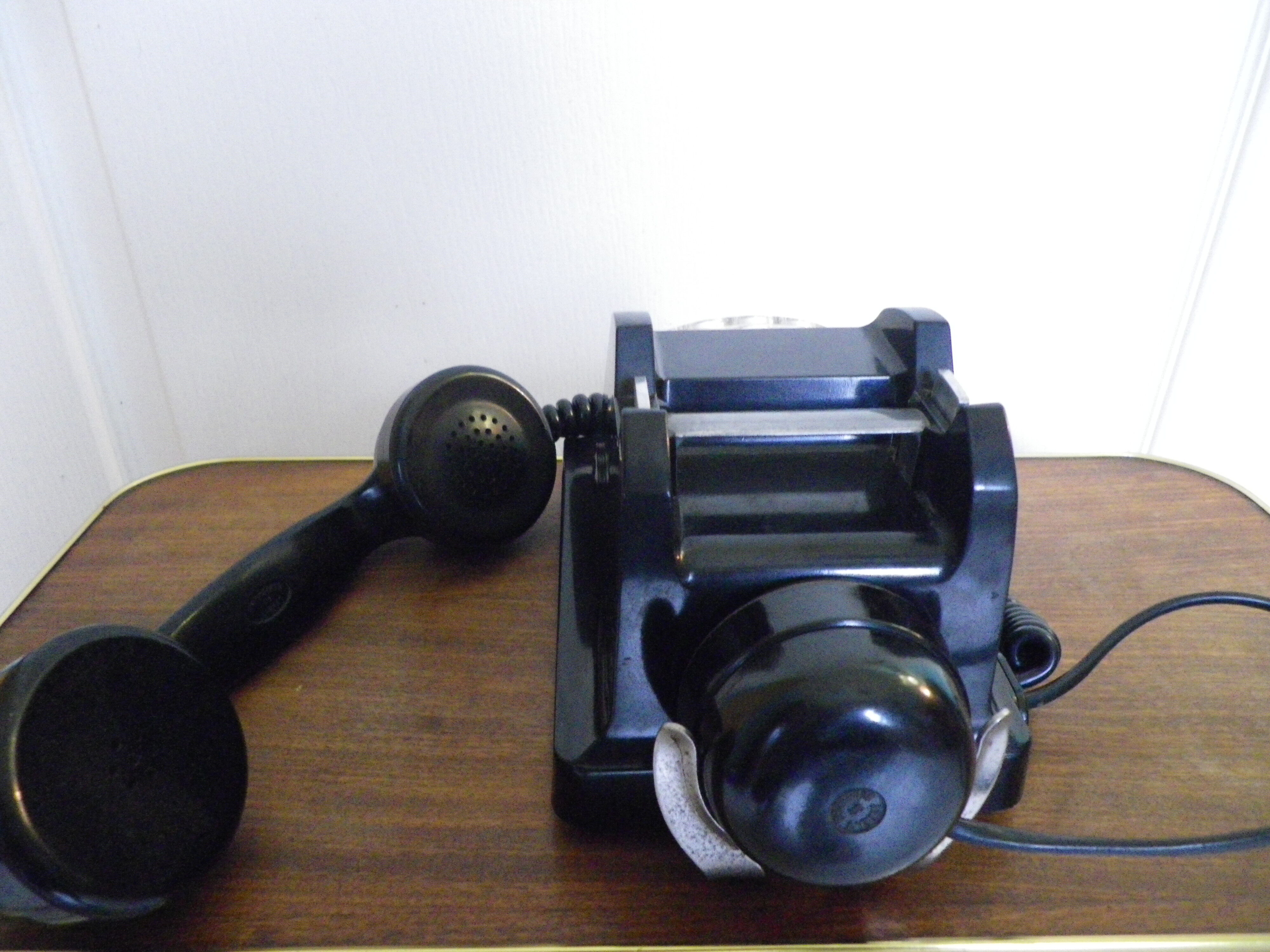 Black bakelite phone with earphone