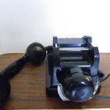 Black bakelite phone with earphone