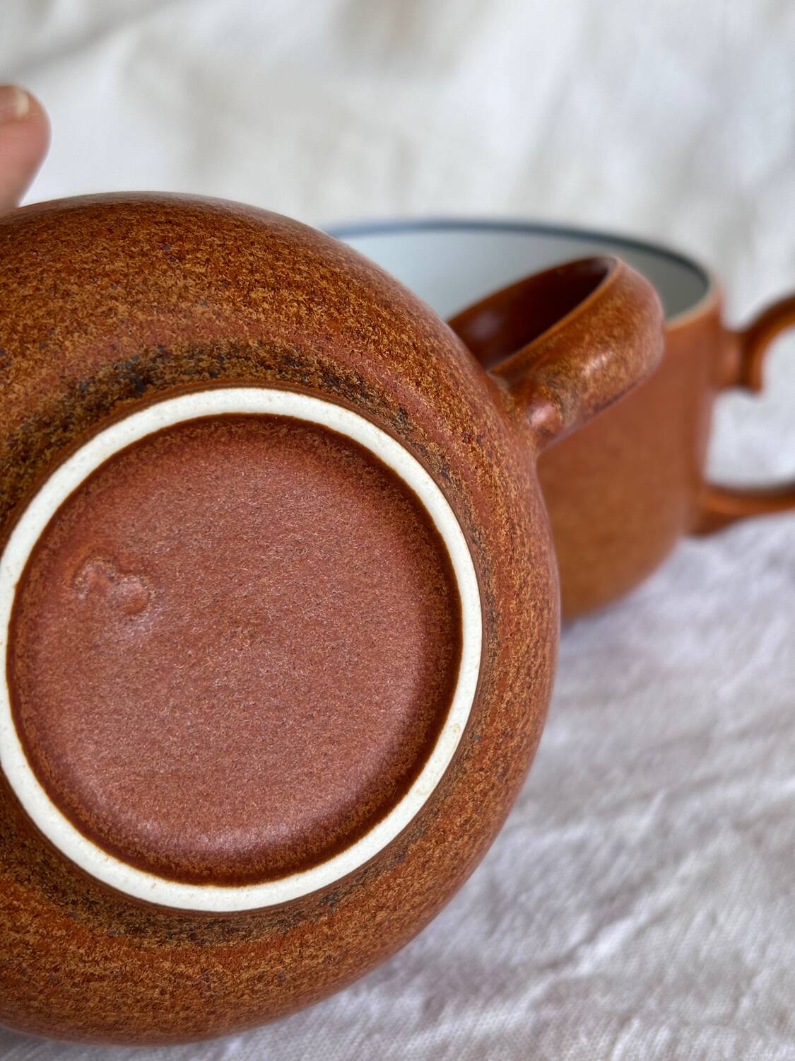 2 very and earthenware coffee cups