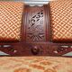 Old bench in wood and orange velvet
