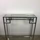 Art Deco style console in chromed metal with glass top