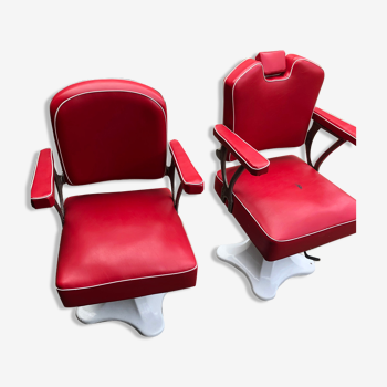 Pair of barber's chairs, enamelled foot