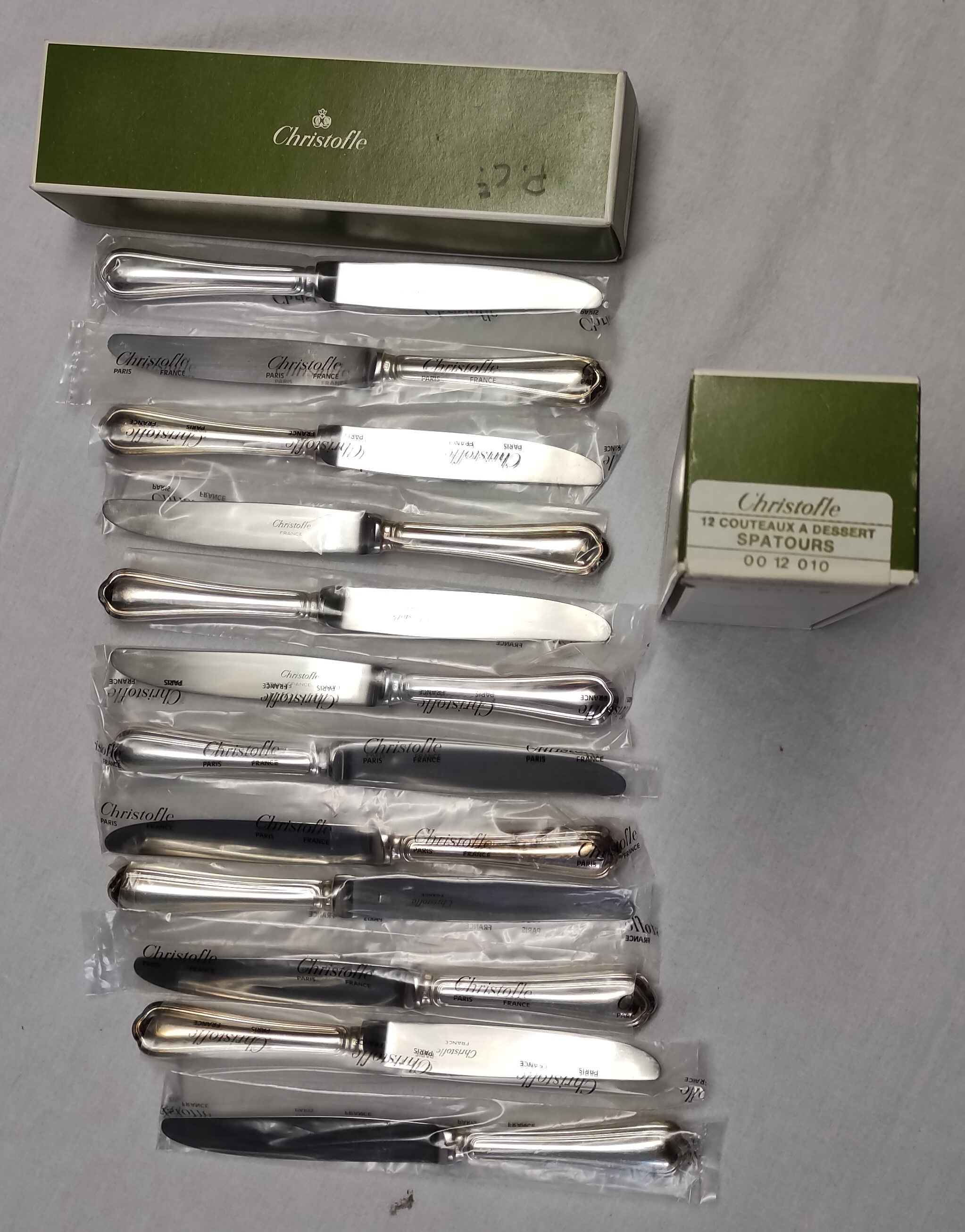 set of 12 silver metal dessert knives from Christofle model "spartours"