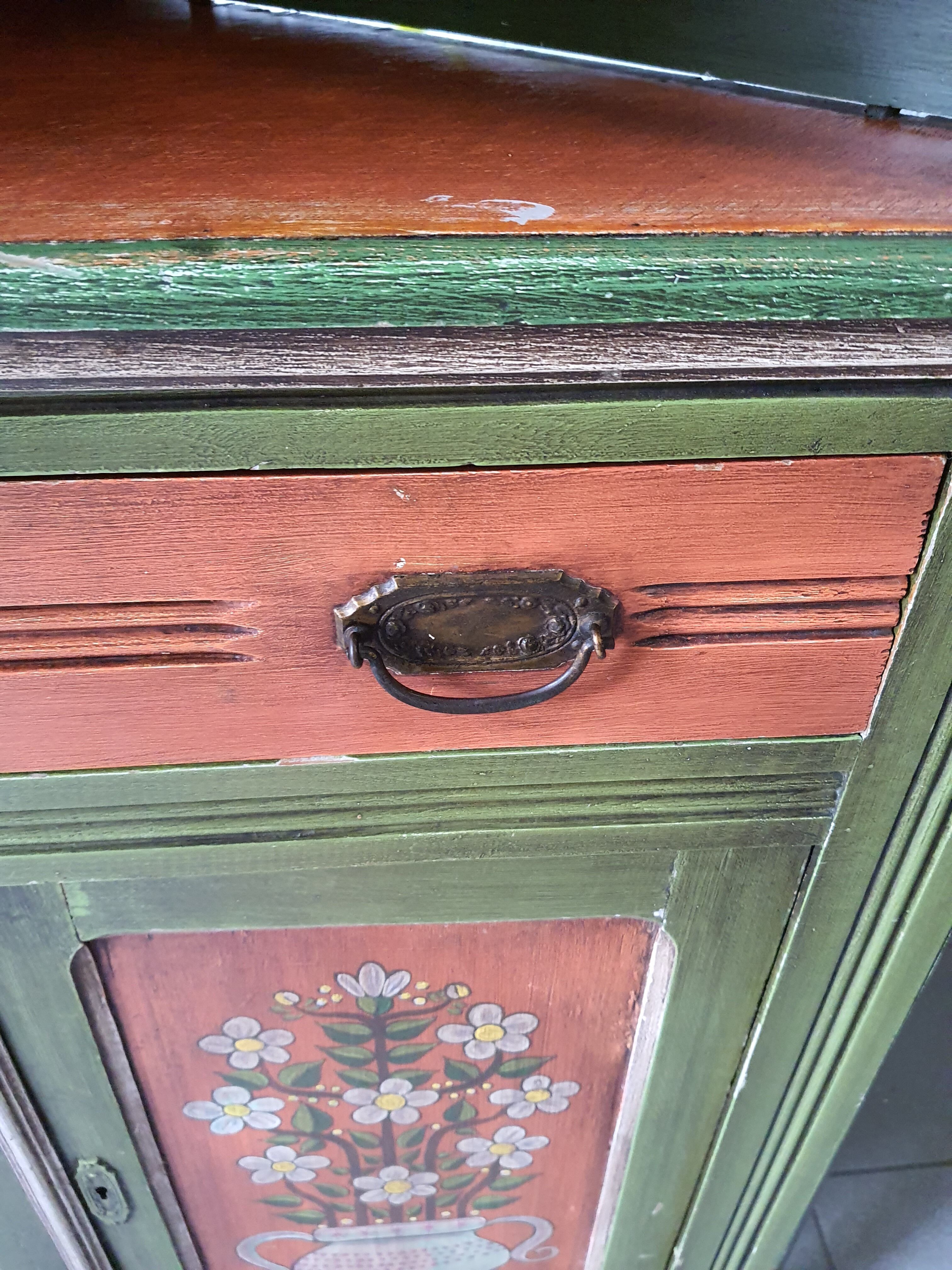 Hand-painted and signed notched cabinet