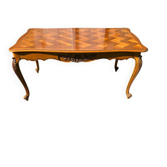 Antique extendable table in cherry wood and marquetry in the Louis XV style.