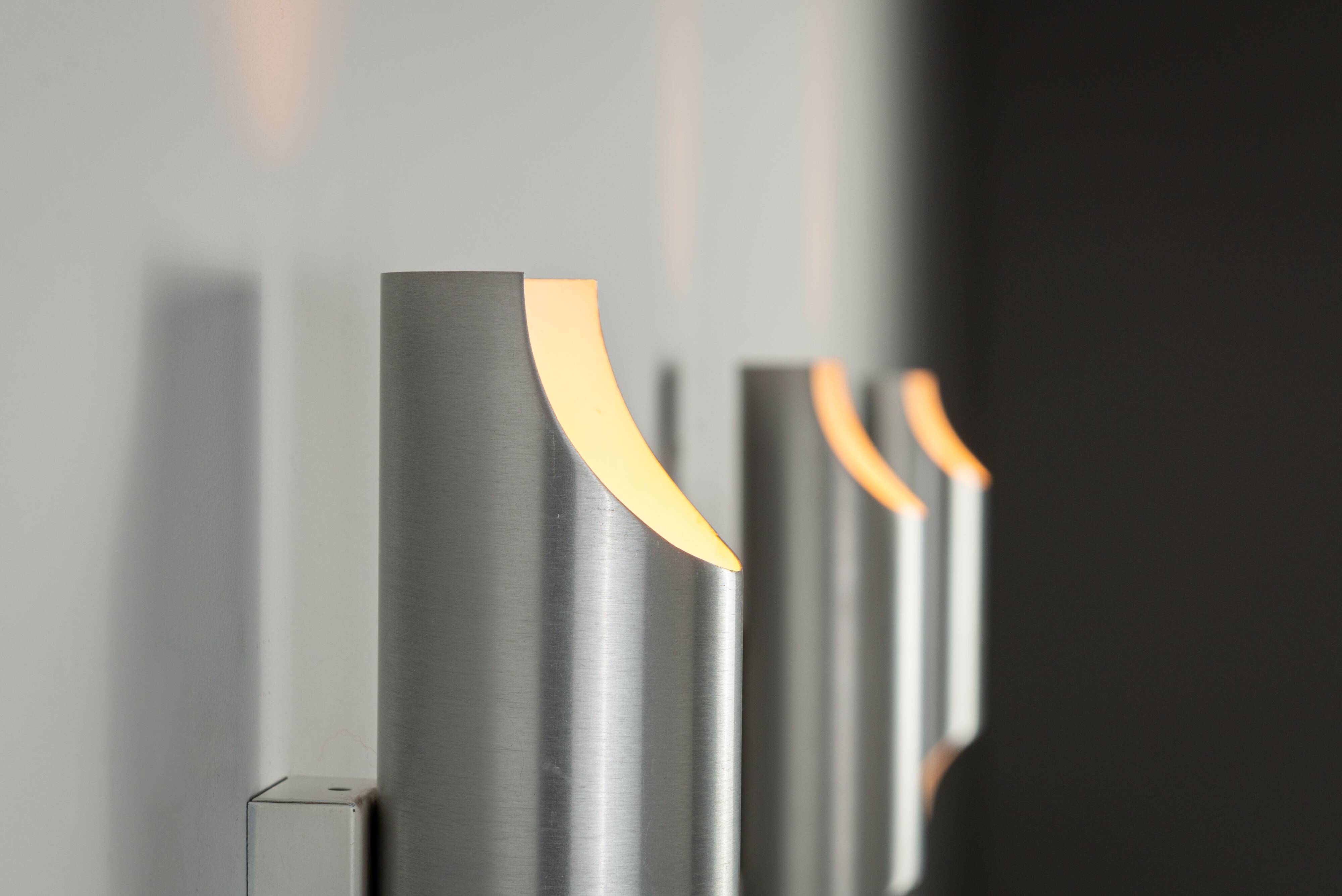 Set of three aluminium cylindrical wall lamps