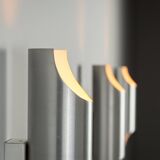 Set of three aluminium cylindrical wall lamps