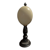 Cabinet of Curiosities ostrich egg Struthio camelus on pedestal