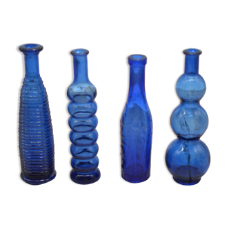 Set of 4 blue bottles of decoration