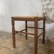 Pair of 20th-century wooden stools with straw seats