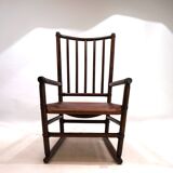 Manou rattan armchair with leather seat, 1960