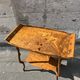 Art Nouveau period two-tiered tea table in veneered wood, signed Émile Gallé