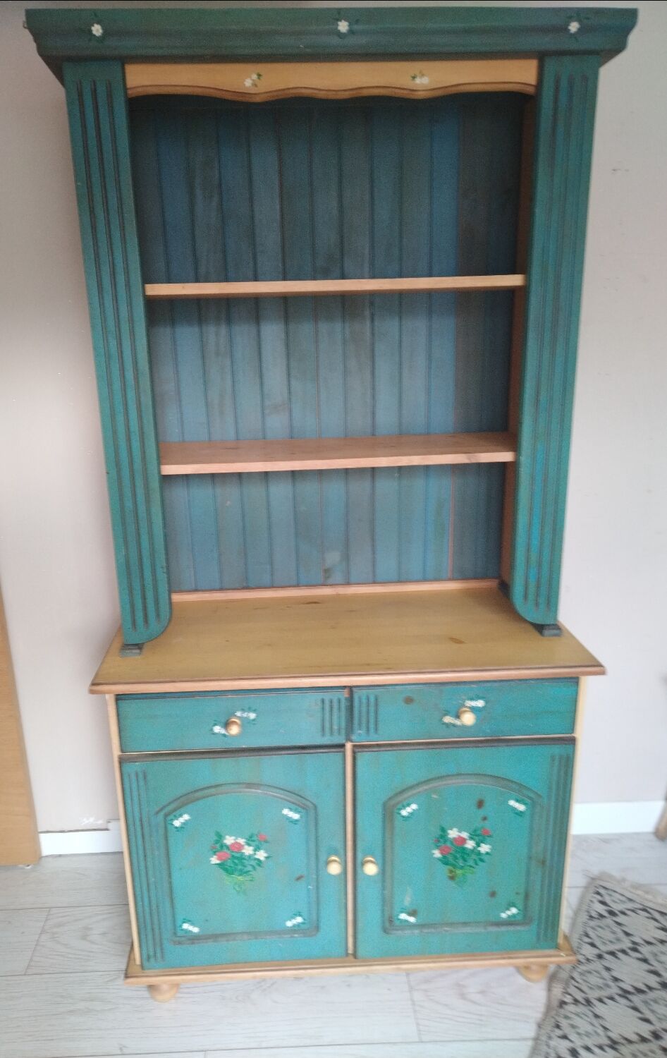 Rustic dresser with floral decor