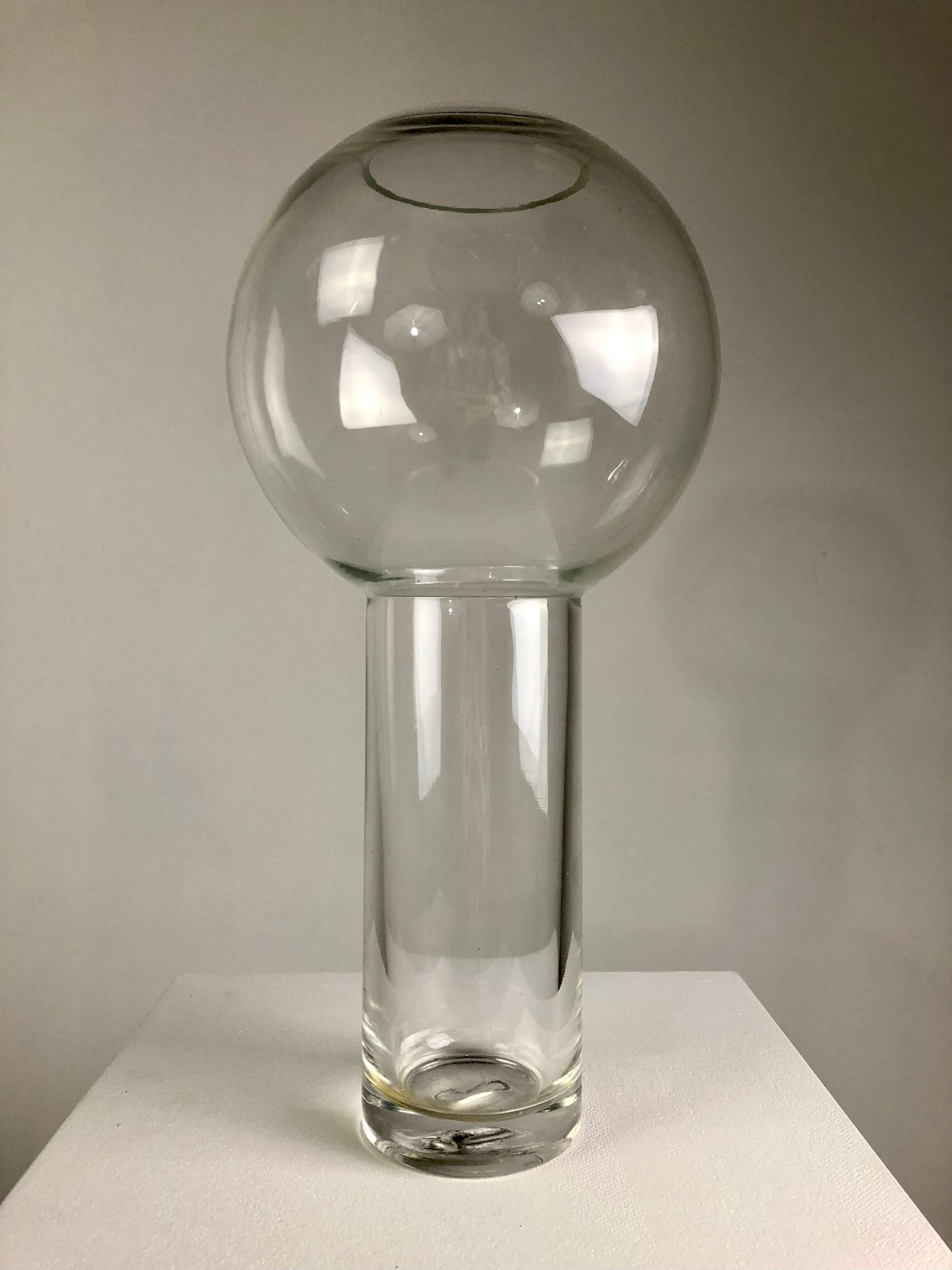 A modernist vase in clear glass.