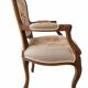 Louis XV style carved wooden armchair with floral needlepoint upholste