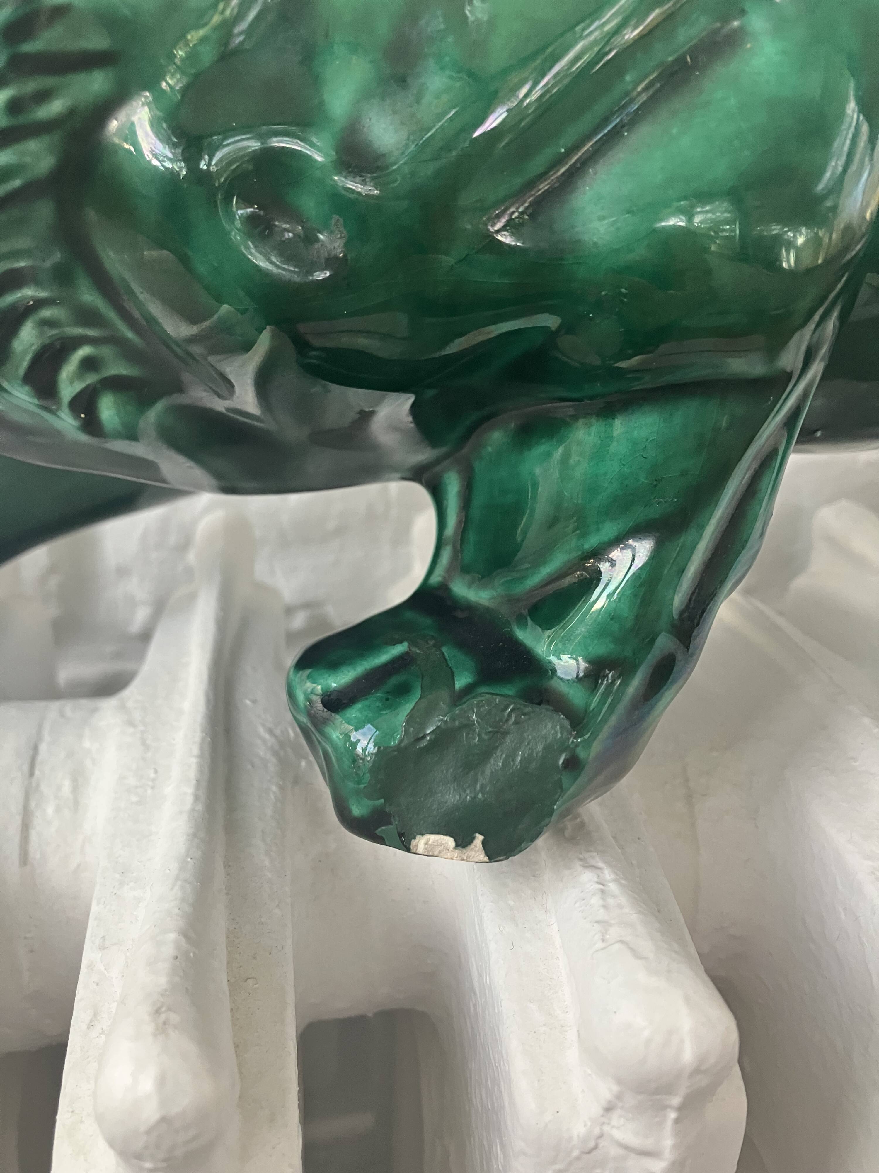 Sculpture of a lion on the lookout in St-Clément