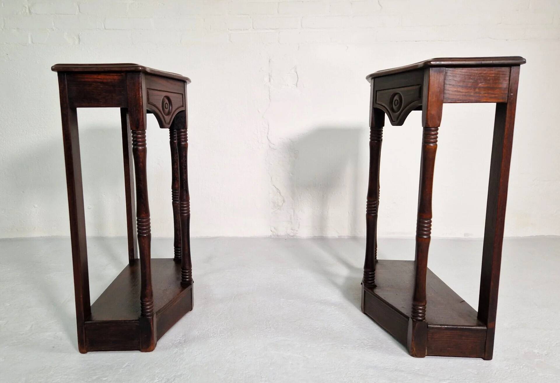 Pair of English 1920s carved oak sidetables