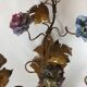 Two bronze wall light decorated with flowers in german porcelain