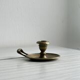 Brass candle holder with handle.
