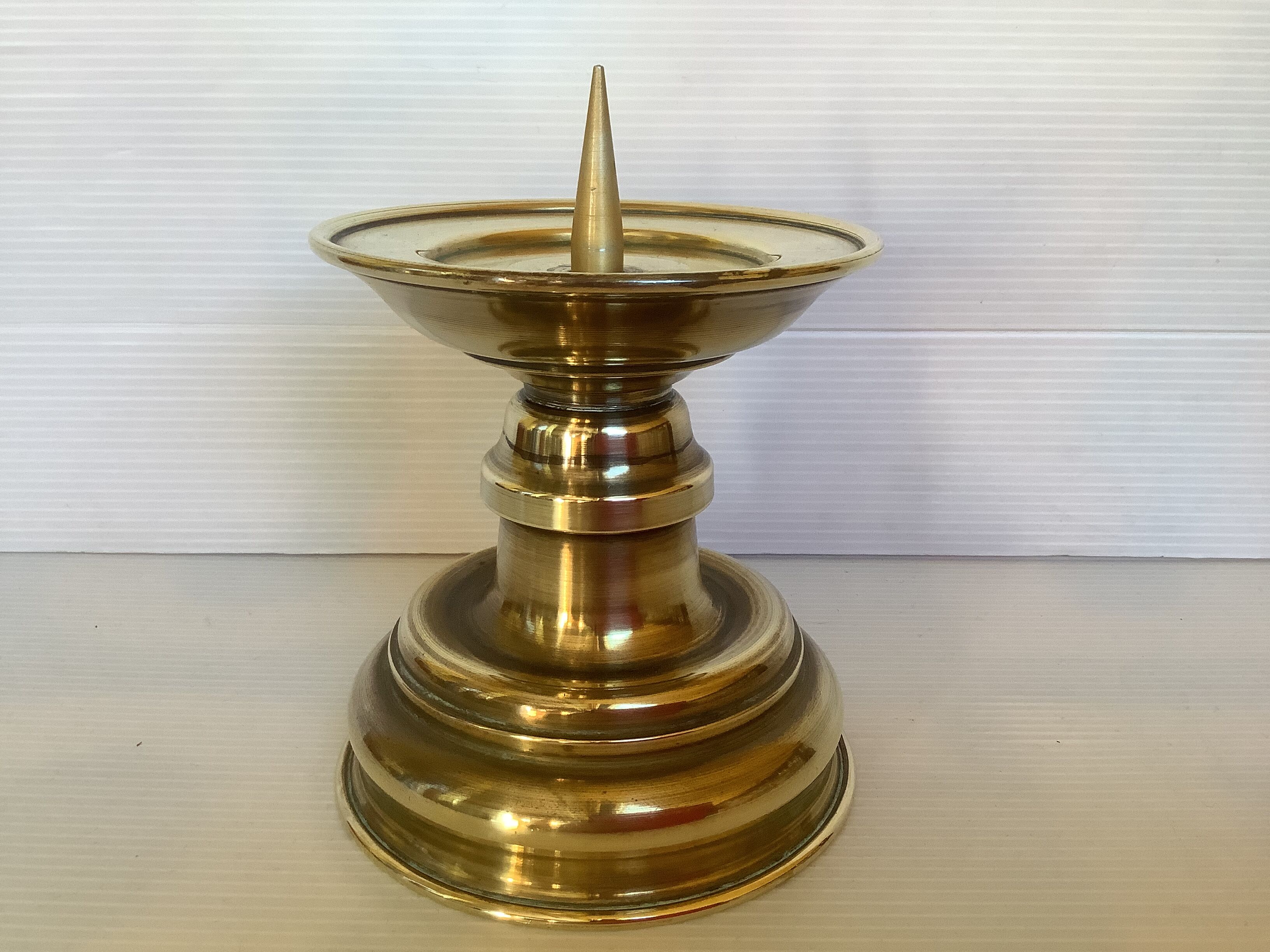 Old brass candle pique