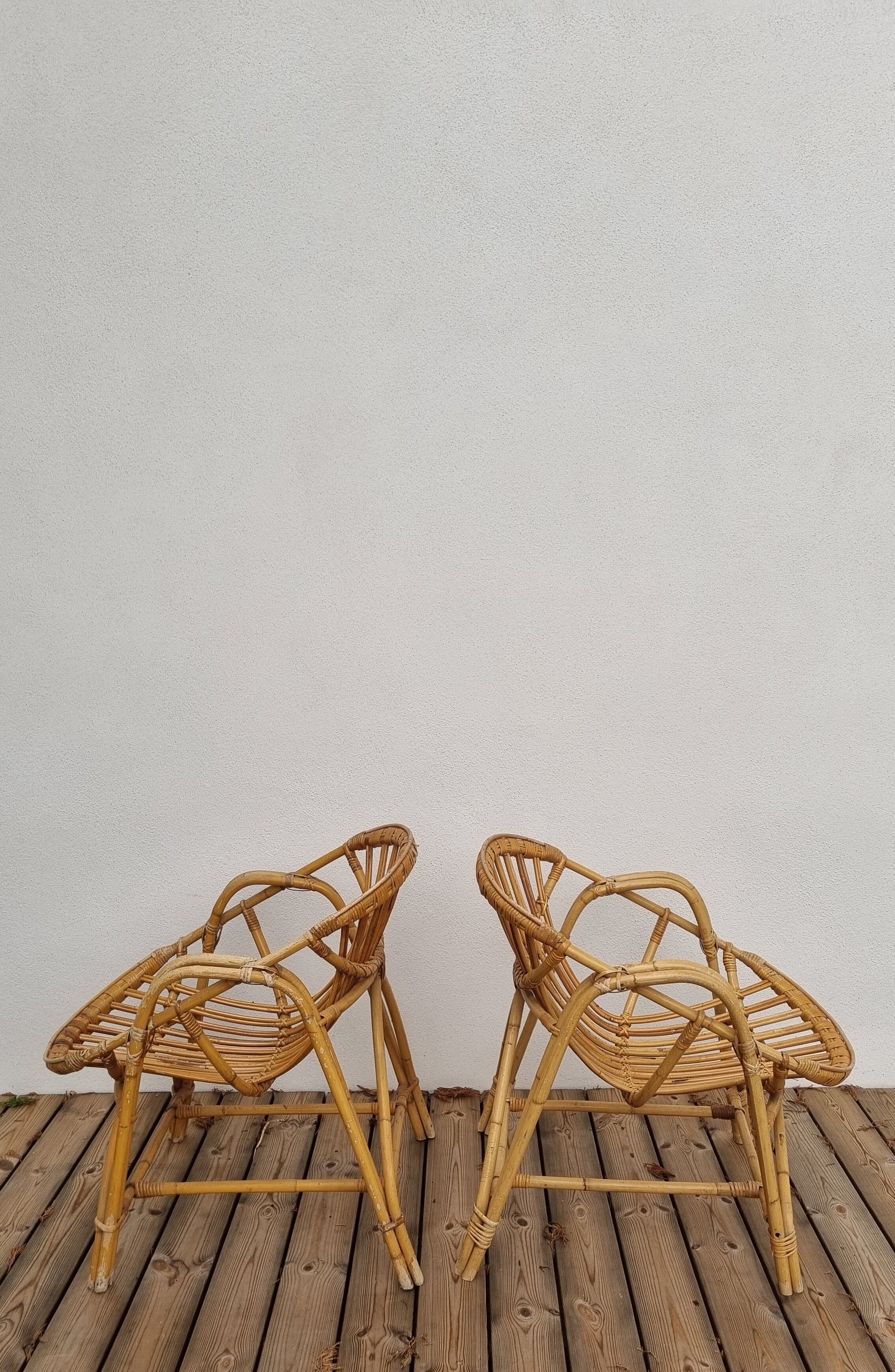 pair of Coquille rattan armchairs