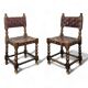 Pair of Spanish style chairs with leather straps.