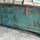 Former industrial workbench in metal