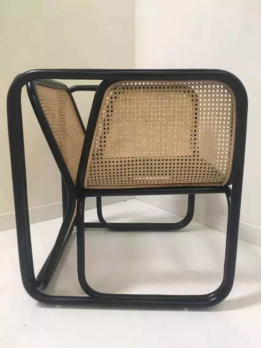 Armchair in black lacquered rattan and natural cane