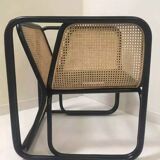 Armchair in black lacquered rattan and natural cane
