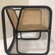 Fauteuil en rotin laqué noir et cannage naturel