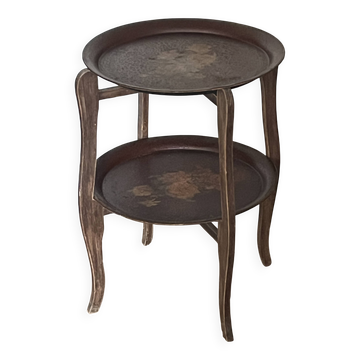 Two old trays on a stand/console.