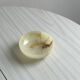 Marbled onyx pocket emptier
